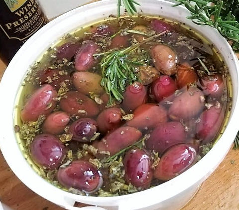 organic pitted Kalamata olives in olive oil and herbs dressing 