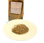 Dried Cretan organic basil on a plate in front of a sachet of Liquid Gold Basil