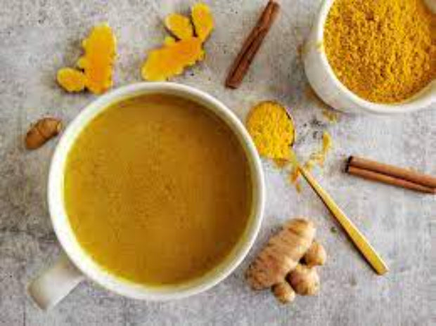 Turmeric golden milk drink made with organic turmeric, black pepper, paprika, ginger, cinnamon and amla