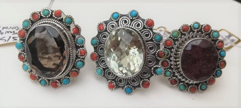 Solid silver rings with large lcentral semi-precious amethyst or garnet, surrounded by turquoise and red coral beads