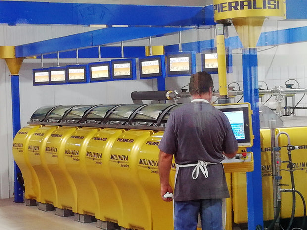 liquid gold organic olive oil at the factory olives pressed in individual mills using state of the art Pieralisi equipment