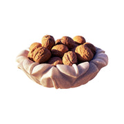 Organic whole walnuts in shell, 500g shown in marble bowl